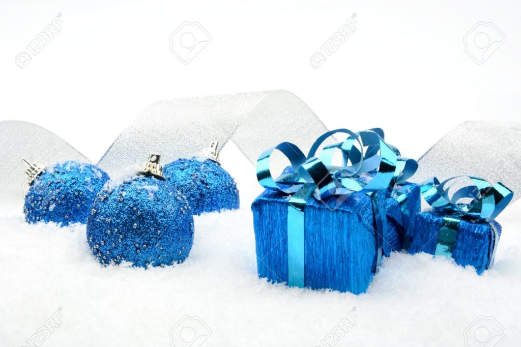 decoration of blue christmas gifts, baubles, silver ribbon on snow